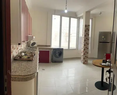 a kitchen with a sink and a stove at appartement chic, calme et bien équipé in Meknès