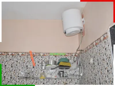 a kitchen with a sink and a light on a wall at Appartement familial en sous-sol près des chutes d'Ouzoud, confortable et sûr in Azilal