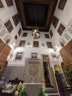 an overhead view of a building with a chandelier at Riad Dar Salma in Fès