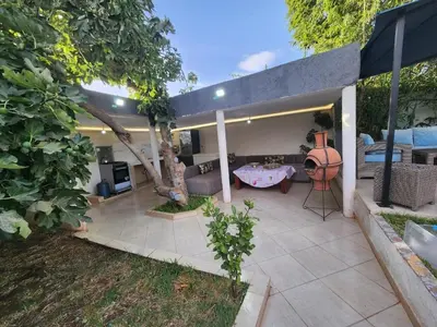 a house with a patio with a couch and a table at Villa Luxe Fès avec Piscine & Spa, proche aéroport, Private Hammam in Fès