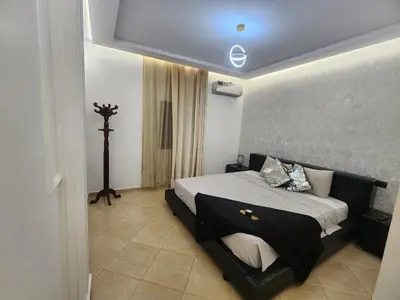 a bedroom with a large bed in a room at Villa Luxe Fès avec Piscine & Spa, proche aéroport, Private Hammam in Fès