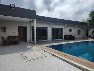 a house with a swimming pool in the yard at Villa Luxe Fès avec Piscine & Spa, proche aéroport, Private Hammam in Fès