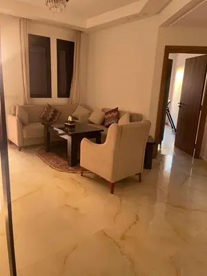 a living room with a couch and a table at Premium village marrakech in Ville Nouvelle