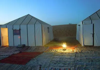 a large tent with a fire inside of it at Sahara Relax Camps in Zagora
