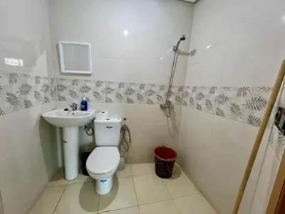 a bathroom with a toilet and a sink at Appart Hotel Noor Fes - Family & Traveler Apartments in Fès