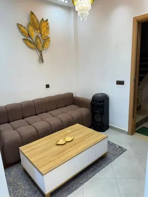a living room with a couch and a coffee table at Dar aya comfort