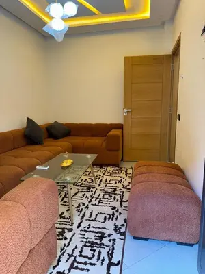 a living room with a couch and a table at Dar aya comfort