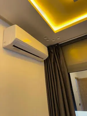 a air conditioner hanging from a ceiling in a room at Dar aya comfort