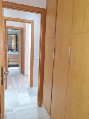 a room with a door leading to a bathroom at Confort in Fès