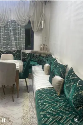 a living room with a couch and a table at فاس in Fès