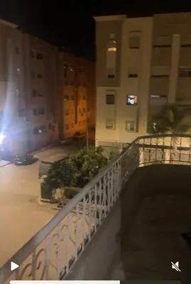 a view of a balcony of a building at night at فاس in Fès