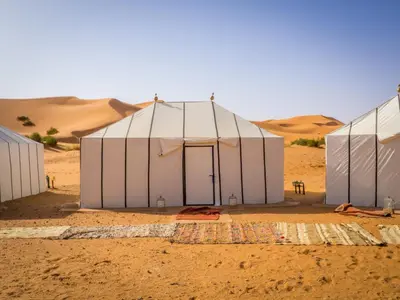 a tent in the middle of the desert at Merzouga Desert Dreams in Merzouga