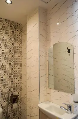 a bathroom with a sink and a mirror at appartement nassime fes 4 chambre in Fès
