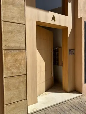 an open door to a building with a wine cellar at Garden View- Gueliz-Majorelle appartement 2 chambres- Wifi et piscines in Oulad Akkou
