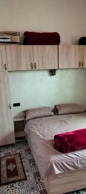 a bedroom with a bed with at Dar Chez Ali in Mhamid