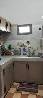a kitchen with a sink and a counter top at Dar Chez Ali in Mhamid