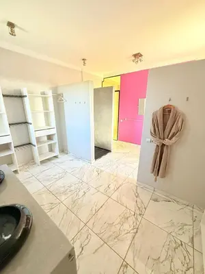a room with a bathroom with a towel hanging on the wall at Villa Five Collection - Private Luxury & Heated Pool