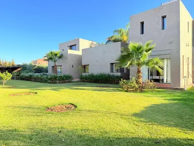 a house with a lawn in front of it at Villa Five Collection - Private Luxury & Heated Pool