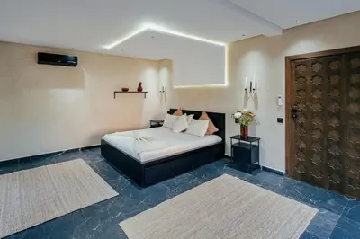 a bedroom with a bed in a room at Stunning luxury Villa with Mountain Views in Sbiti
