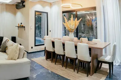 a dining room with a table and chairs at Stunning luxury Villa with Mountain Views in Sbiti