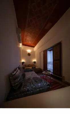 a bedroom with a bed and a window at Dar bab jdid Rcif- step away from historic sites in Fès