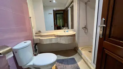 a bathroom with a toilet and a sink at Prestigia Luxury Apartments Fes in Fès