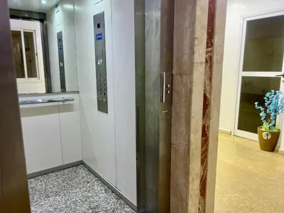 a hallway with elevators in a building at Prestigia Luxury Apartments Fes in Fès