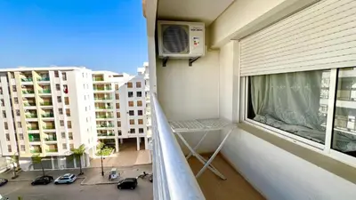 a balcony with a heater and a window at Prestigia Luxury Apartments Fes in Fès