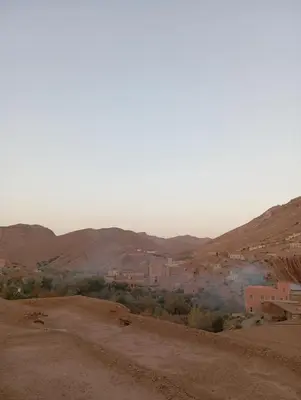 a view of a village in the desert at Auberge le calme restaurante in Bou Tharar