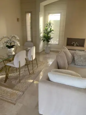 a living room with a couch and a table at Villa à Marrakech-avec piscine privėe in Douar Soukkane