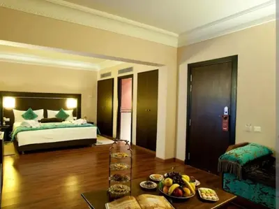 a hotel room with a bed and a table with food at slimane in Aït Hallouane
