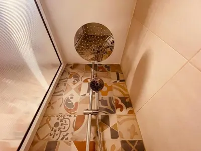 a room with a ceiling with a mirror on the floor at Zyon Family in Oulad Akkou