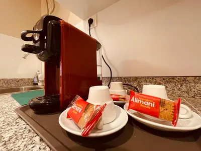 a counter with two plates of food and a coffee maker at Zyon Family in Oulad Akkou