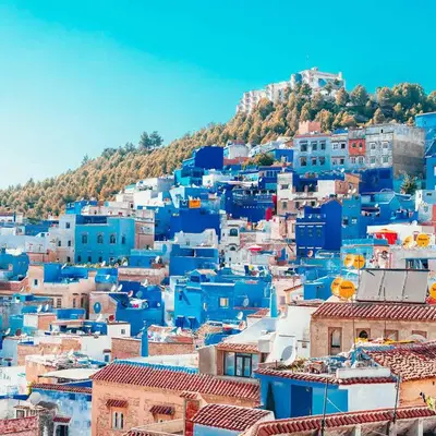 a view of a city with blue buildings at test in Merzouga
