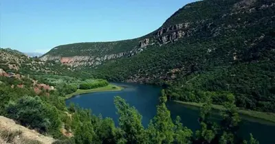 a lake in the middle of a mountain at test in Merzouga
