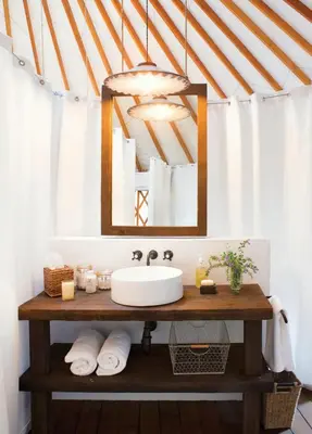 a bathroom with a sink and a mirror at Zeus Sahara Luxury Camp in Merzouga