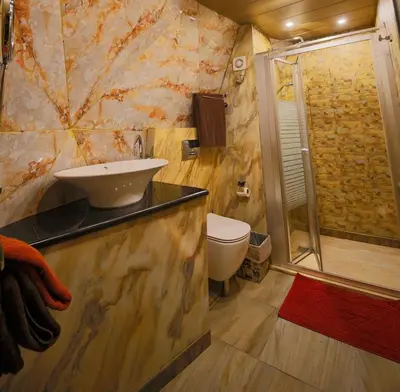 a bathroom with a sink and a shower at Zeus Sahara Luxury Camp in Merzouga