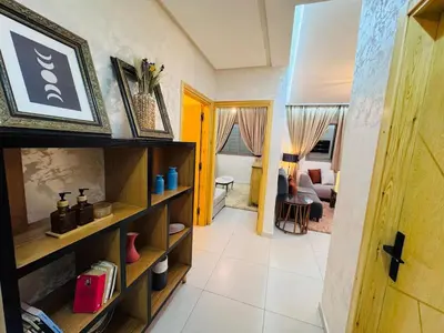 a room with a living room with a couch at URBAN WHITE Elya 2 in Beni Mellal