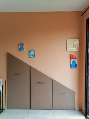 a wall with four drawers in a room at Tynass Ferme - Chefchaouen Room - Fes