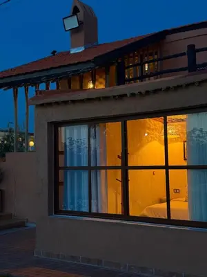 a building with a window with a bed in it at Tynass Ferme - Walili Room Fez