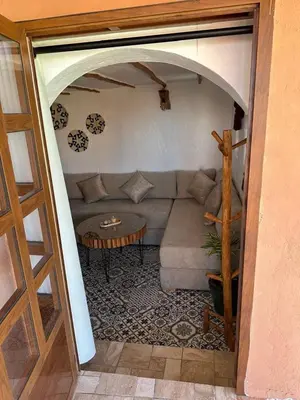 a living room with a couch and a table at Ferme Tynass - Tynass Suite - Spacious Suite in Tynass Farm