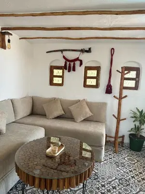 a living room with a couch and a table at Ferme Tynass - Tynass Suite - Spacious Suite in Tynass Farm