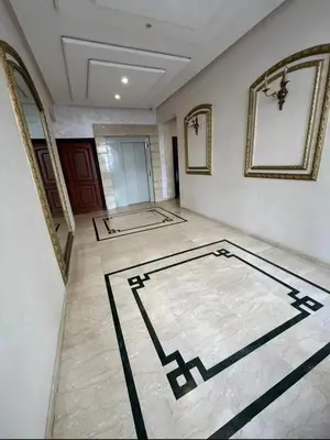 a large room with a tile floor and a hallway at Mandela in Oulad Akkou