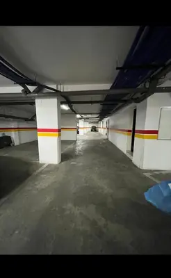 an empty parking garage with a car parked in it at Mandela in Oulad Akkou
