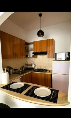 a kitchen with two white plates on a counter at Mandela in Oulad Akkou