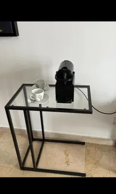 a glass table with a tea pot and cups on it at Mandela in Oulad Akkou