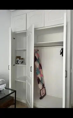 a door to a closet with a surfboard in it at Mandela in Oulad Akkou