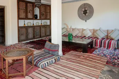 a living room with a couch and a table at Atlas Aura Hotel Ourika - Marrakech