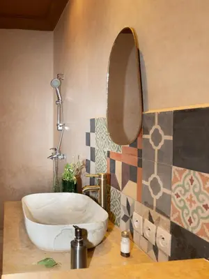 a bathroom with a sink and a mirror at Atlas Aura Hotel Ourika - Marrakech