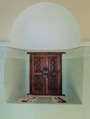 a wooden cabinet in the corner of a room at Atlas Aura Hotel Ourika - Marrakech
